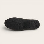 Botín Llaima negro de cuero de vacuno con suela de caucho antideslizante de OLKI.