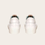 Zapatilla OLKI Real blanca de capellada con acolchado  y planta de plataforma.