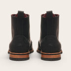 Botín Osorno Negro Planta Negra de cuero para hombre de OLKI. Diseño clásico con tirante trasero y suela de cuero y caucho.