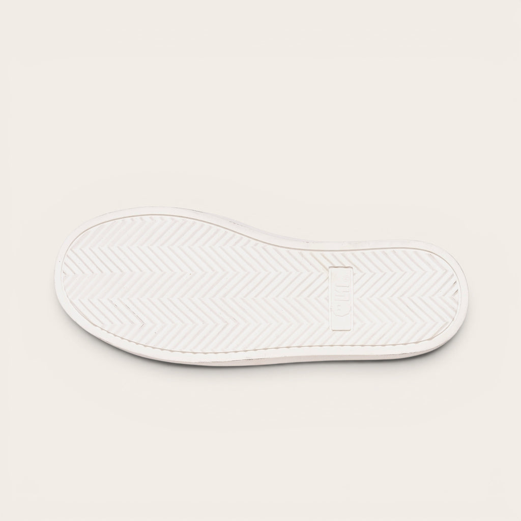 OLKI Zapatilla Calán de planta blanca con patrón de espiga para un agarre óptimo.