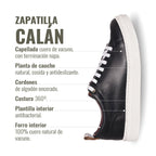 Zapatilla Calán negra de cuero de vacuno con cordones de algodón encerado y planta de caucho antideslizante. OLKI