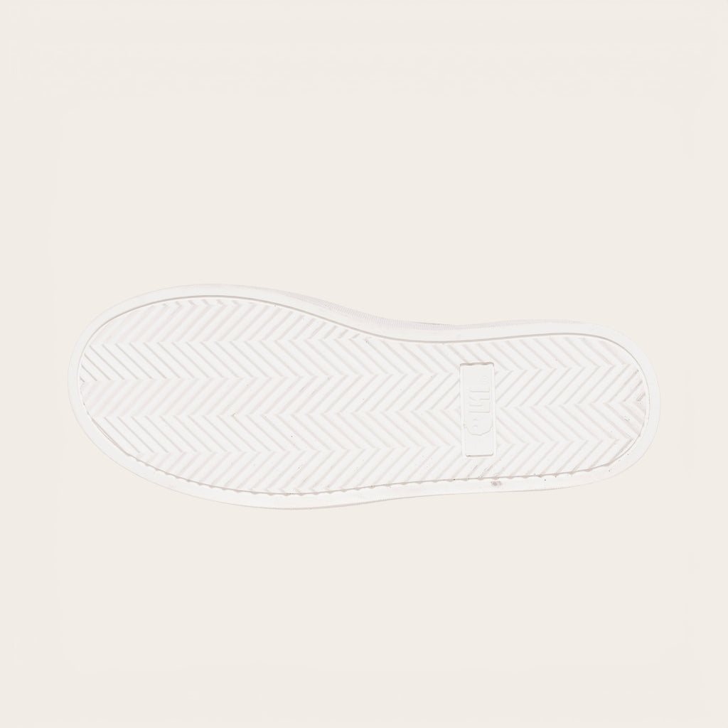 OLKI Zapatilla Calán verde musgo con planta blanca de goma y diseño de espiga. Ideal para uso diario.