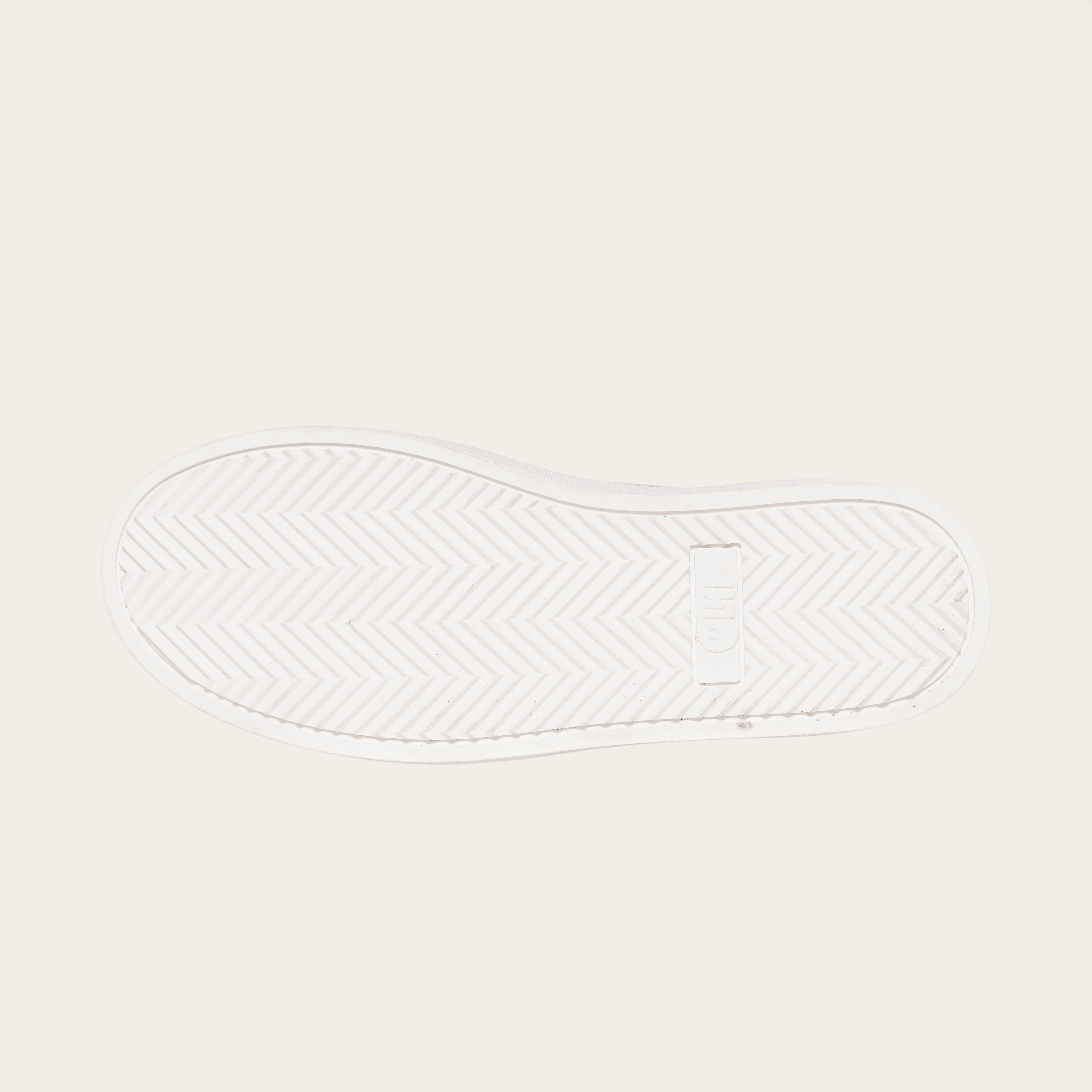 OLKI Zapatilla Calán verde musgo con planta blanca de goma y diseño de espiga. Ideal para uso diario.