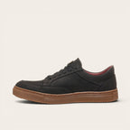 Zapatilla OLKI La Campana negra de cuero con planta de caucho cristal y forro burdeos. Diseño urbano y minimalista.