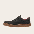 Zapatilla OLKI La Campana negra de cuero con planta de caucho cristal y forro burdeos. Diseño urbano y minimalista.