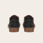 Zapatillas OLKI La Campana negras de cuero con forro burdeo y planta de caucho cristal.