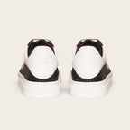 Zapatilla OLKI Nevado negra de cuero con talonera blanca y planta de caucho. Diseño artesanal chileno.