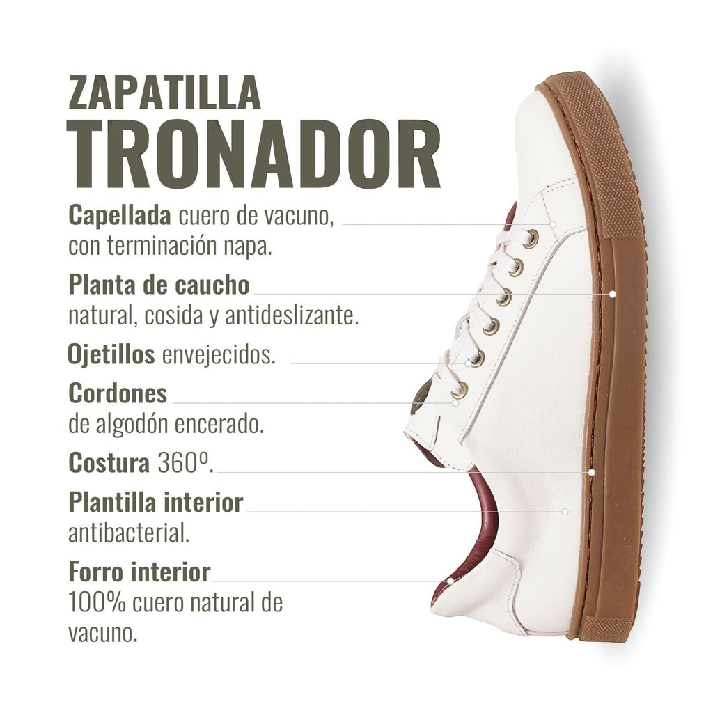 Zapatilla Tronador blanca de cuero de vacuno con forro de cuero guinda y planta de caucho antideslizante. Marca OLKI.