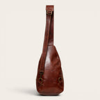 Bandolera Cunco Castaño de cuero de vacuno de OLKI con correa ajustable y herrajes envejecidos. Capacidad 3.5L.
