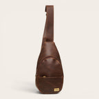 Bandolera Cunco de cuero natural color chocolate de OLKI con bolsillo exterior y cierre seguro. Ideal para uso diario.
