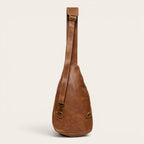 Bandolera Cunco Habano de cuero natural de vacuno en color marrón, con correa ajustable y detalles metálicos envejecidos. OLKI