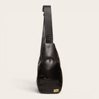Bandolera Cunco Negro de cuero negro de OLKI con correa ajustable y bolsillo exterior. Diseño ergonómico para uso diario.