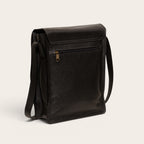 Bandolera OLKI Lautaro negra texturizada de cuero con bolsillo trasero con cremallera y correa ajustable.