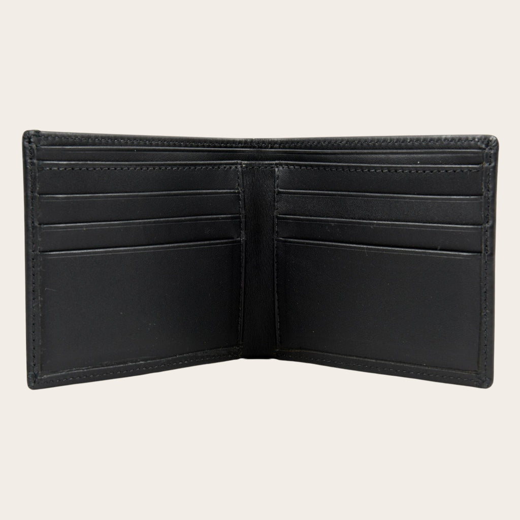 Billetera OLKI Ñuble Negra de cuero con múltiples ranuras para tarjetas y compartimentos para billetes.