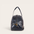 Bolso de viaje OLKI Baker azul marino de cuero con cremallera metálica y asas superiores.