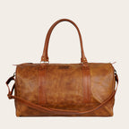 Bolso de viaje OLKI Futaleufu Carmelo Combinado de cuero genuino en tono caramel con detalles en cuero oscuro.