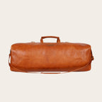 Bolso de viaje OLKI Yelcho en cuero color curry con asas y correa ajustable para escapadas de fin de semana.