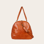 Bolso de viaje OLKI Futaleufu Curry de cuero natural de vacuno con correa ajustable y costuras reforzadas. 45 litros.