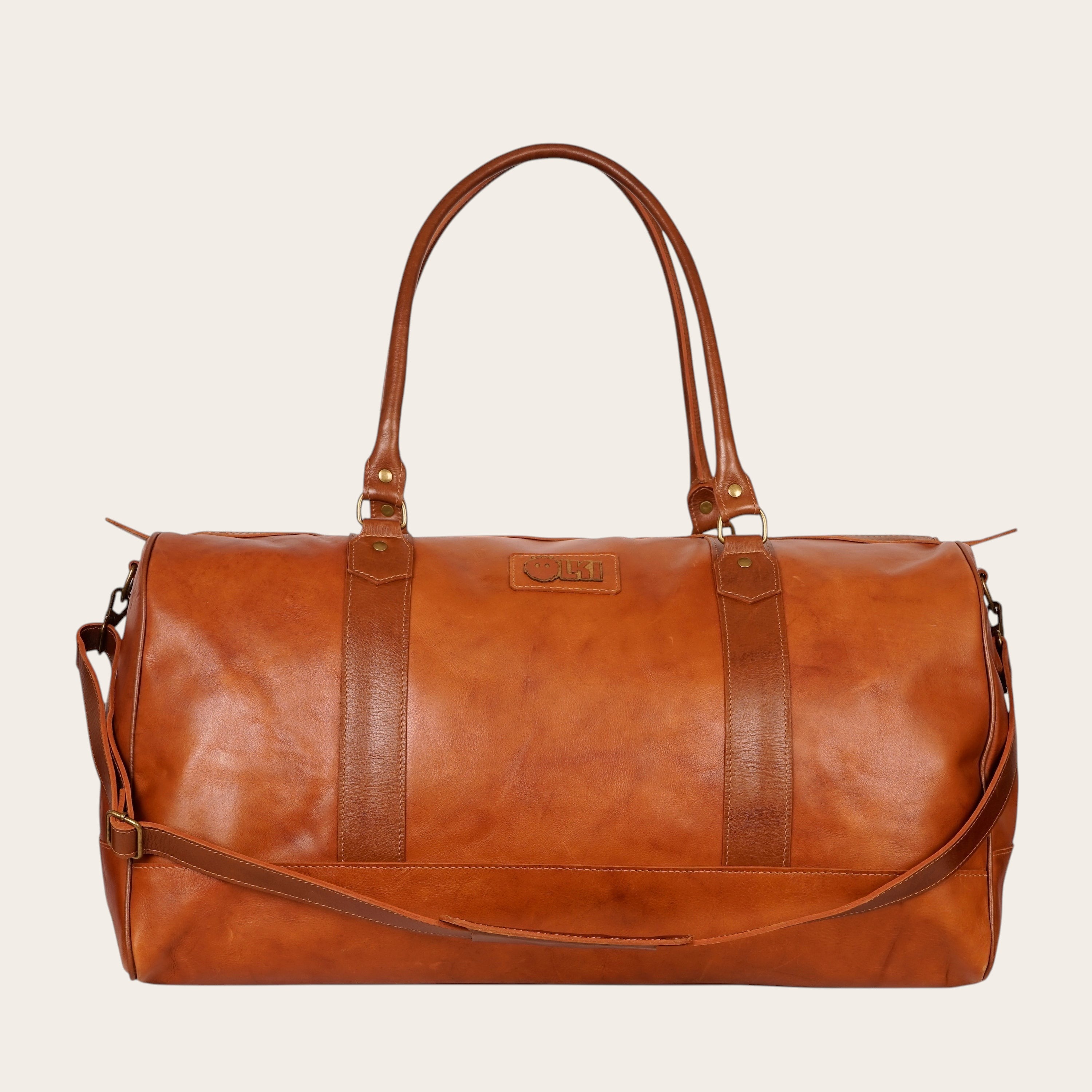 Bolso de viaje OLKI Futaleufu Curry Combinado de cuero con asas y correa ajustable. Ideal para escapadas.