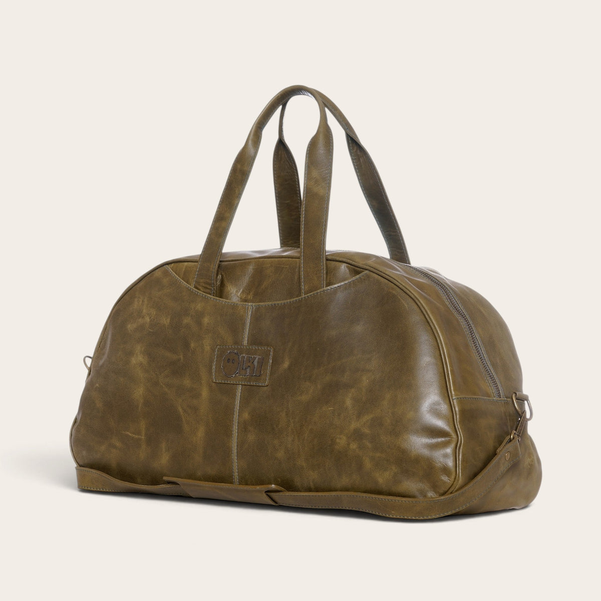 Bolso de viaje OLKI Baker en cuero verde con asas resistentes y diseño espacioso para escapadas de fin de semana