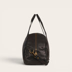 Bolso de viaje Baker negro de cuero de OLKI con asas superiores y correa de hombro desmontable.