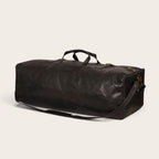 Bolso de viaje OLKI Yelcho negro de piel con asas y correa de hombro, ideal para escapadas.