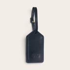Identificador de equipaje OLKI Huasco en cuero natural color negro con correa ajustable y logo grabado