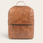 Mochila OLKI Toltén de cuero habano con compartimento para portátil.