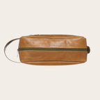 Neceser OLKI Loa de cuero color caramelo con cremallera verde y asa lateral. Ideal para viajes.