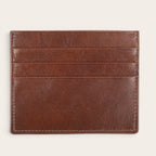 Tarjetero Rapel Castaño de piel con múltiples ranuras para tarjetas. Diseño minimalista y elegante en tono marrón.
