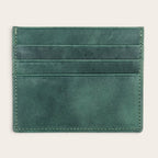 Tarjetero OLKI Rapel verde musgo de piel con múltiples ranuras para tarjetas. Diseño minimalista y funcional.