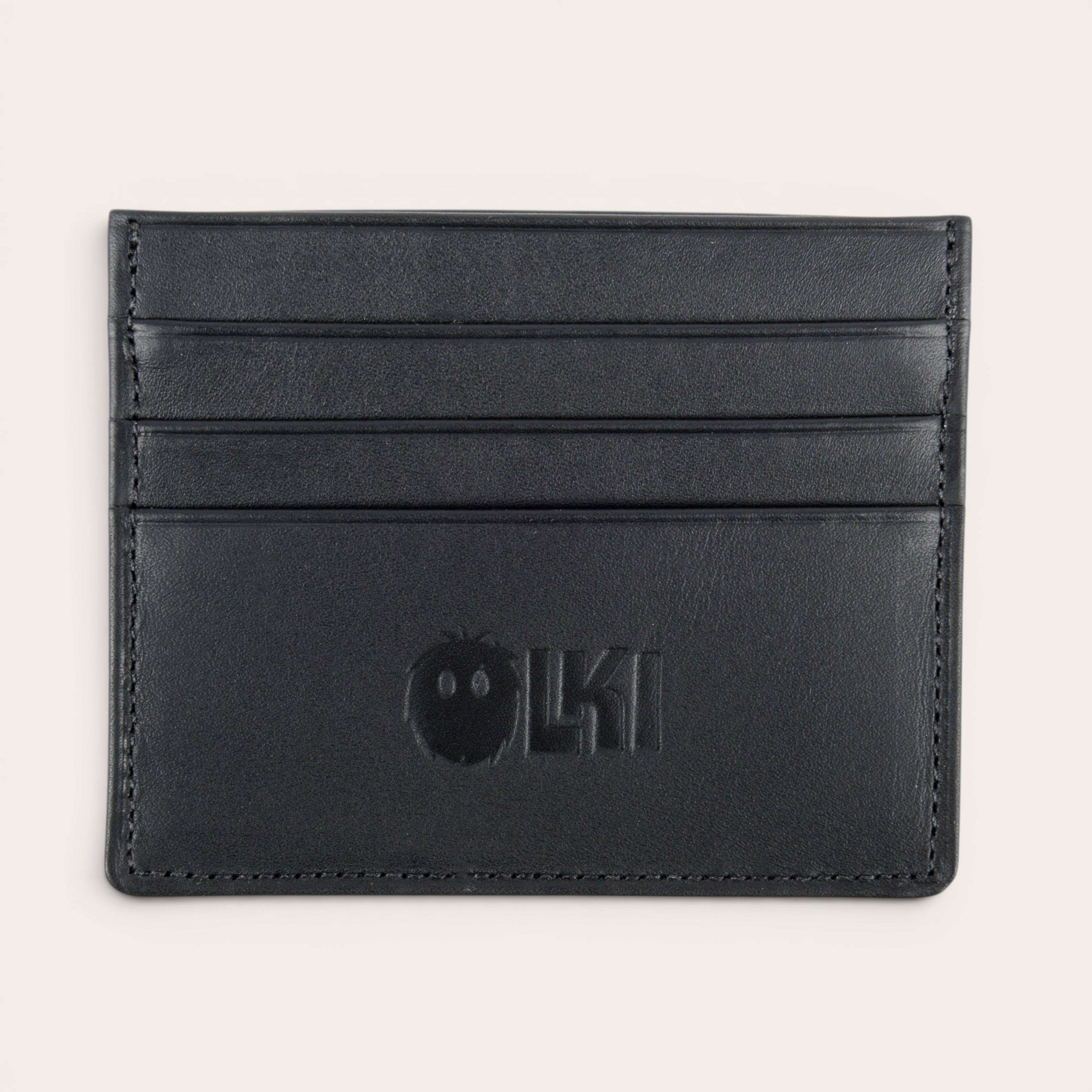 Tarjetero Rapel Negro de cuero de OLKI con múltiples ranuras para tarjetas y logo grabado.