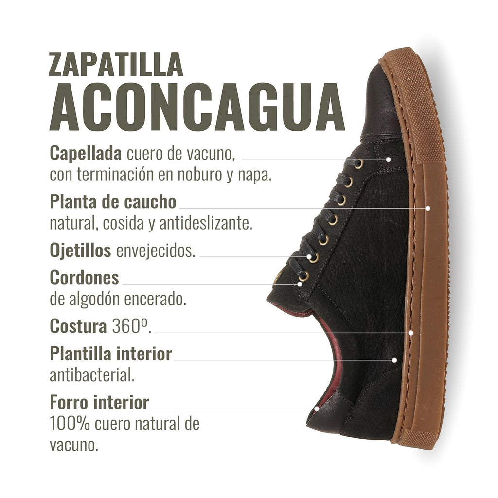 Zapatilla OLKI Aconcagua de cuero negro con detalles camel, suela de caucho y cordones encerados. Hecha a mano en Chile.